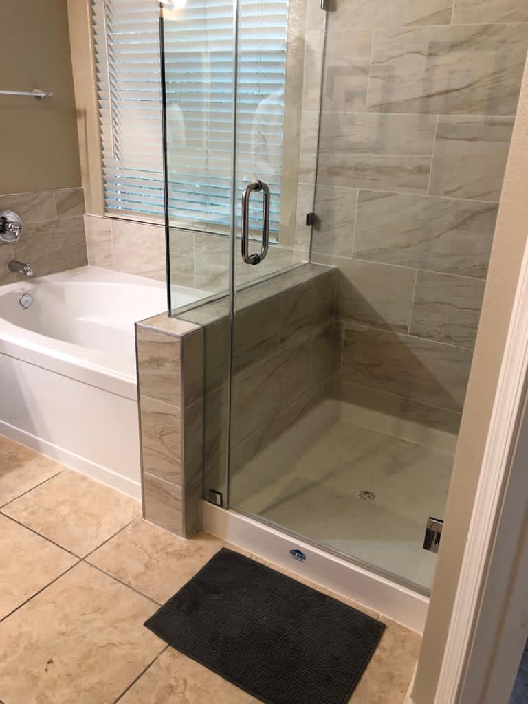Bathroom with bathtub and shower