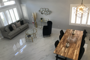 White living room with dining table